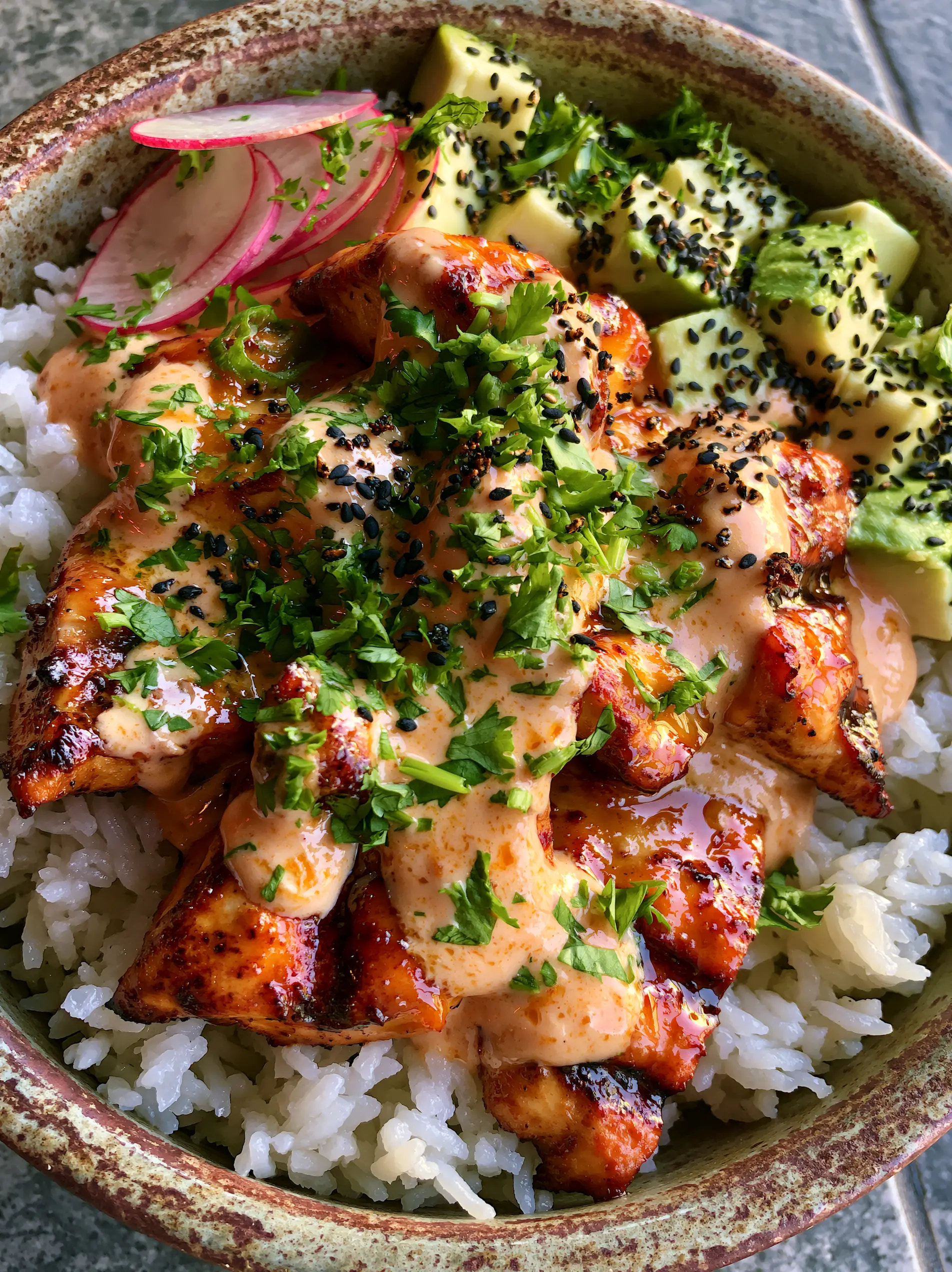 Close-up of grilled honey-soy chicken with char marks over fluffy coconut rice. (stroller)